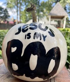 a black and white pumpkin with the words jesus is my boo on it