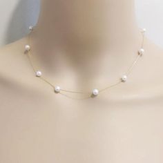 Item No: NK584Item:sterling silver pearl necklacePearl shape:round shapePearl size:5-6mmPearl color: whitePearl skin: with little flawsPearl luster: goodPearl quality: AAthe space between two pearl: 3.5cmChain length: 16inch,18inch,20inch,22inch,24inch,26inch,27.5inchChain: sterling silver with white gold plated, or yellow gold platedPacking: beautiful giftbox, ready for gift givingPlease contact Lisha if any more questions. Spaced Out Pearl Necklace, 5 Pearl Necklace, Gold Pearl Jewelry Necklace Classic, Bride With Pearl Necklace, Pearl Necklace Prom, Pearl Bridal Necklace, Dainty Single Strand White Chain Necklace, White Pearl Necklace With Delicate Chain For Formal Occasions, Dainty White Single Strand Chain Necklace