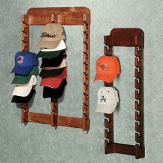 several hats are hanging on the wall next to a rack with baseball caps in it