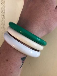 Three vintage bangle bracelets, unsure of the material, green, white, and cream. Good vintage condition Bracelets Green, Three Strand Necklace, Christmas Card Ornaments, Vintage Bangle Bracelets, Plastic Bangles, Bakelite Bangles, Costume Jewelry Sets, Vintage Bangles, Bangle Bracelet Set