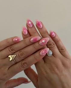 These nails feature a delightful pink ombre design with white star and bow accents, reminiscent of a breezy summer sunset.  🌸Click on the image to shop our trending Korean Gel Polish this season.  🌸Credit: bresheppard on Instagram 🌸summer nails, pink aura nails, star nails, bow nails, Korean gel polish, trending nail designs, summer manicure, pink gradient nails, nail art trends, Instagram nail art, summer nail inspiration, gel nail designs, cute summer nails, pink and white nails, summer nail polish, nail art ideas, summer nail trends, stylish nails, summer nail fashion, trendy nails Pink Gellac Nailart, Summer Nails Pink And White, Stylish Nails Summer, White Nails Summer, Pink Gradient Nails, Korean Gel Polish, Pink Aura Nails, Diy Gel Manicure, Star Nail Designs