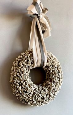 a wreath hanging from the side of a wall