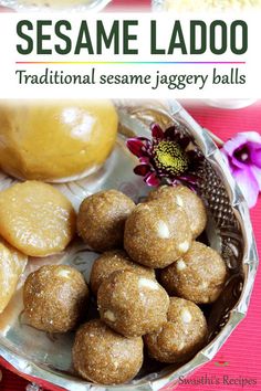 some ladoos are sitting in a bowl on a red tablecloth with flowers