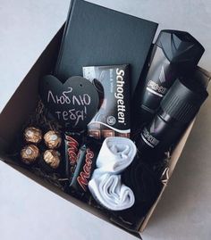 an open box filled with chocolates and other items