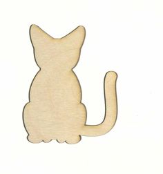 a wooden cutout of a cat on a white background