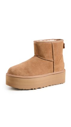 PRICES MAY VARY. Suede upper Overlock stitch detailing on seams 17mm UGGplush upcycled wool lining and sockliner Treadlite by UGG outsole 2" platform height Ugg Classic Mini Platform, Ugg Bag, Ugg Store, Ugg Womens, Overlock Stitch, Ugg Classic Mini, Ugg Classic, Classic Boots, Dream Shoes