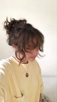 girl with curly short hair in a messy ponytail with bangs wearing a yellow tshirt pouting Her Hair, A Woman, Bed, Wall, White