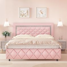 a pink bed with white sheets and pillows in a light colored room, next to two framed pictures on the wall