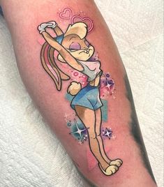 a cartoon character tattoo on the leg of a person with an arm and legs crossed