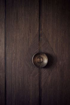 a wooden door with a metal knob on it