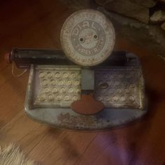 an old typewriter sitting on top of a wooden floor