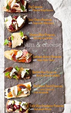 an image of a menu for food on a slate platter with cheeses and cranberry sauce