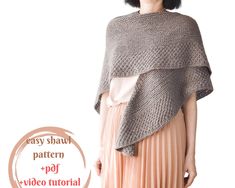 a woman wearing a gray shawl and pink pleated skirt with the words easy shawl pattern on it