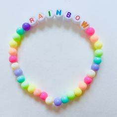 Cute pastel rainbow bracelets, handmade Adjustable Rainbow Beaded Bracelets Playful Style, Adjustable Rainbow Beaded Bracelets In Playful Style, Adjustable Rainbow Beaded Bracelets, Playful Style, Handmade Rainbow Jewelry For Friendship, Trendy Rainbow Beaded Bracelet, Trendy Beaded Rainbow Friendship Bracelets, Handmade Rainbow Casual Jewelry, Handmade Pastel Bracelets For Gift, Trendy Rainbow Round Beads Bracelets