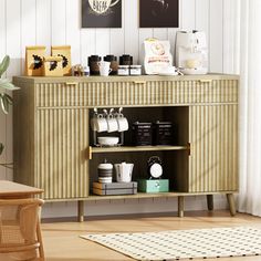 a room with a wooden cabinet and pictures on the wall