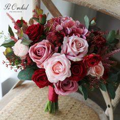 a bouquet of flowers sitting on top of a chair