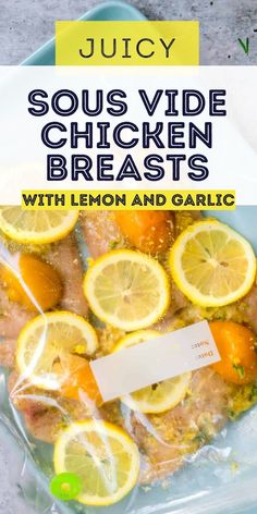 a close up of chicken breast with lemons and garlic