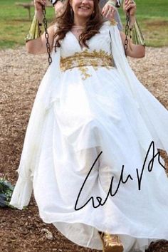 a woman in a wedding dress holding two parasols