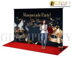 a woman standing in front of a masquerade party backdrop