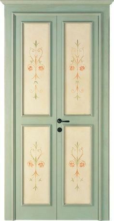 an image of a green door with flowers painted on the front and side panels above it