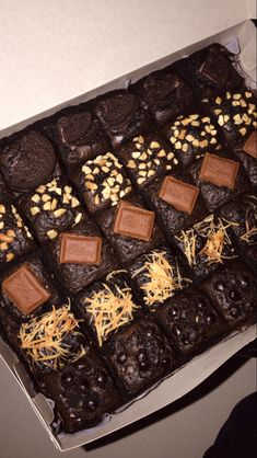 a box filled with lots of brownies and nuts