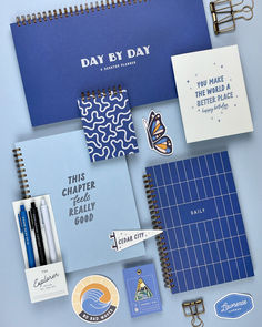 A collection of blue notebooks, pens, stickers, and other stationery items. Cute Agenda Ideas, Planner Book Design, Gift Shop Design, Stationery Flatlay, Got Stickers, Stationary Design Inspiration, Stationary Brand, Stationery Photography, Trendy Stationery