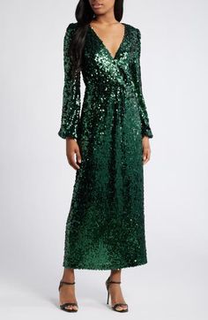 Be a verdant vision in a glittering gown designed with a graceful neckline and gently belled sleeves. Hidden back-zip closure Surplice V-neck Long sleeves Lined 95% polyester, 5% elastane Hand wash, line dry Imported Sleeve Gown, Long Sleeve Gown, Nordstrom Store, Fabric Gifts, Free Fabric, Gowns Dresses, Carry On, Sequin, Emerald