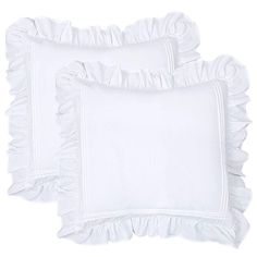 two white pillows with ruffled edges