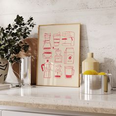 a kitchen counter with an art print on the wall next to some cups and vases