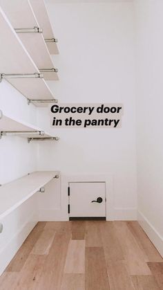 an empty room with shelves and a sign on the wall that says grocery door in the pantry