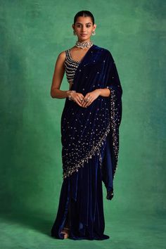 Blue silk velvet pre-draped saree featuring a draped silhouette highlighted by sequin scatter and pearl drop embellishments. Comes with matching blouse highlighted with sequin and pearl embellished stripe patterns. - Aza Fashions Velvet Saree With Zari Work For Reception, Designer Velvet Saree With Traditional Drape, Festive Designer Velvet Saree, Designer Velvet Saree For Diwali, Velvet Saree For Diwali With Traditional Drape, Diwali Designer Velvet Saree, Semi-stitched Velvet Saree In Elegant Style, Velvet Saree With Zari Work And Traditional Drape, Festive Velvet Saree With Sheer Dupatta