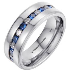 a white gold ring with blue and clear stones on the inside, set in 18k white gold