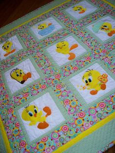 a baby quilt with ducks on it