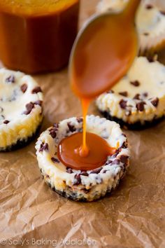 chocolate chip cookies with caramel sauce being drizzled on them