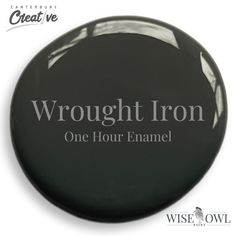 a black button with the words,'through iron one hour enamel'on it