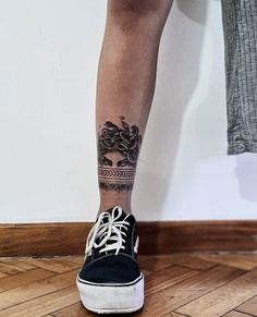 a person's legs with tattoos on them