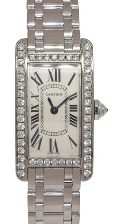 Contact us Have a question? Contact us. Free Shipping Complimentary next day delivery fully insured shipping. BUYER PROTECTION Security guaranteed with eBay buyer protection. Cartier Tank Americaine 18k White Gold Diamond Ladies Quartz Watch WB7073L1 2489 Very good preowned ladies Cartier Tank Americaine in 18k white gold features silver dial with Roman numerals and blue sword-shaped hands. Original diamond bezel. Quartz movement. Comes on Cartier 18k white gold bracelet with butterfly deployant. Fits up to 6-1/4 inch wrist. We are a family owned brick and mortar Jewelry Store specializing in fine new and pre-owned jewelry and watches. Each of our pre-owned watches is fully checked, serviced, and detailed. All items guaranteed authentic. Specs Brand Cartier Model Tank Americaine Reference Cartier Tank Americaine, Model Tanks, Cartier Tank, White Gold Bracelet, Brick And Mortar, White Gold Band, Bezel Diamond, Roman Numerals, Jewelry Store