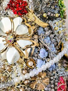 an assortment of brooches, pearls and other jewelry