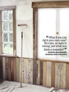 a bathroom with wood paneling and a quote on the wall