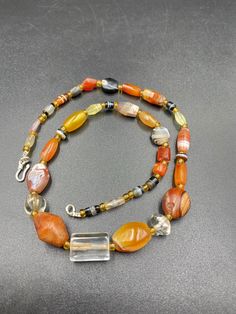 Beautiful collection of rare and genuine very old Agates, Carnelian and Crystal Quartz necklace. The counters are made of glass beads. All the beads are old but the necklace has been newly made with a very attractive design 10 pictures are there you can swipe each to see all pictures we provide fast and free shipping service world wide Vintage Handmade Agate Beads, Gems, And Cabochons, Handmade Vintage Agate Beads, Gems, And Cabochons, Vintage Carnelian Beaded Necklace, Handmade Vintage Agate Beads, Vintage Agate Beaded Necklace With Large Beads, Vintage Beaded Carnelian Necklace, Vintage Agate Beaded Necklaces With Large Beads, Vintage Beaded Necklace For Healing With Natural Stones, Vintage Gemstone Beaded Necklaces For Jewelry Making