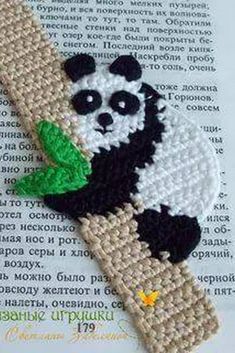 a panda bear is sitting on top of a tree branch with leaves in its paws