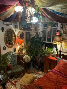 a living room filled with lots of furniture and decor on top of a carpeted floor