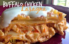 a close up of food on a plate with the words buffalo chicken lasagna