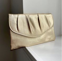 - Vintage Gold Lamé Clutch - Gorgeous metallic gold color - Envelope Clutch with hidden snap closure - Measures: 9.75" x 6.25" - Ships free, with tracking, within the United States Clutch Prom, Prom Purse, Metallic Gold Color, Gold Lame, Gold Clutch, Bridal Clutch, Vintage Clutch, Purse Vintage, Envelope Clutch