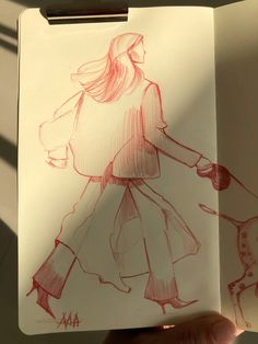 a drawing of a woman walking with a dog in her hand and the image is drawn on paper