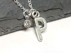 A dainty personalised necklace on a delicate sterling silver chain with your choice of pewter letter charm and a sparkling diamante crystal. Makes a lovely and unique gift for women and girls for birthdays and special occasions, which is sure to be treasured. Delivered in a complimentary gift box Cz Jewelry, Monogram Necklace, Lovely Necklace, Initial Pendant, 925 Sterling Silver Chain