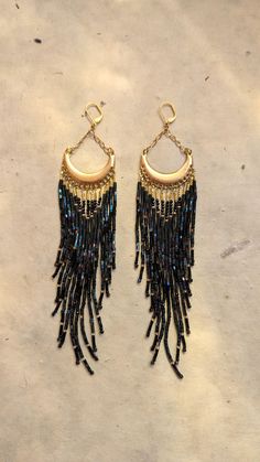 ♀ Handmade beaded earrings created glass beads, brass, and Japanese nylon thread for ultimate durability. ♀ Drop Height: 7 in. ♀ Beads: Toho, Czech ♀ Ear Wire: 18k gold-plated surgical steel  ♀ Thread: Nylon ♀ Nickel Free Black Bohemian Beaded Chain Earrings, Moon Phases Beaded Earrings, Moon Fringe Earrings, Gothic Seed Bead Earrings, Black Large Beaded Dangle, Beaded Moon, Black Boho, Handmade Earrings Beaded, Moon Earrings