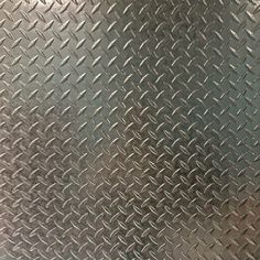 a close up view of a metal diamond plate