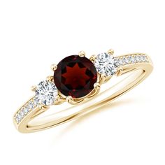 The deep red garnet and side diamonds are secured in prong settings on this classic three-stone ring. Pave-set diamonds are embellished on the shank that complete the brilliant look of this 18k yellow gold ring. Girls Ring, January Birthstone Jewelry, Gold For Women, Garnet And Diamond Ring, 3 Stone Ring, Ruby Diamond Rings, Bracelet Love, 3 Stone Rings, Rose Gold Diamond Ring