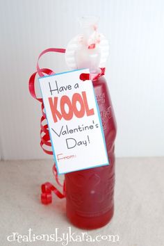 a valentine's day treat in a bottle with a sign attached to it that says have a kool valentine's day